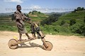 Young Rwandese Boy,  Riding a Wooden Byke !