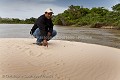 Jaguar footprints on river bank.