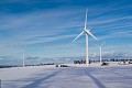 Wind Mills in field under the snow.