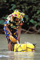 Woman collecting non-drinking water from water hole