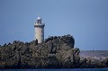 Phare de Kéréon encore caché par les roches de l'île Bannec.
Mer d'Iroise. Bretagne. Au fond, Ouessant. archipel 
 bleu 
 Bretagne 
 calme 
 chenal 
 ciel 
 courants 
 été 
 Finistère 
 France 
 Fromveur 
 gardien 
 Iroise 
 Kéréon 
 marin 
 mer 
 Molène 
 navigation 
 Oessant 
 Phare 