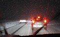 La RN12 en Bretagne entre Rennes et Saint-Brieuc le 1er décembre, vers 18H30, juste quelques kilomètres avant d'être bloqué et de sortir JUSTE A TEMPS de la 4 voies.  Ayant réussi à faire demi-tour miraculeusement direction Rennes, quelques minutes après cette photo prise en roulant aux pas avec mon Canon G12, exactement au même endroit, des centaines et des centaines de voitures et de camions ont été bloqués toute la nuit... Bon, j'avais prévu et j'avais mon "Survival Kit" avec moi juste au cas où : eau, thermos de thé, nourriture, chocolat (pour le moral...), sac de couchage bien chaud, lampe frontale, lampe à main ultra-puissante, le téléphone portable (iPhone) et... de la lecture !
 route, 
neige,
Bretagne,
nuit, 
circulation,
hiver,
France,
blocage,
météo,
averse,
 