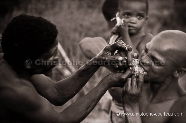 Bushmen Hunters eating together