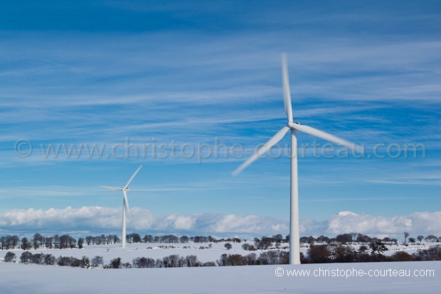 Wind Mills in field under the snow.