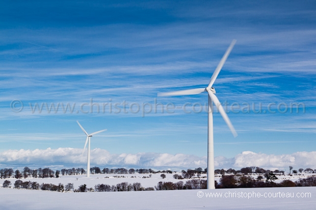 Wind Mills in field under the snow.