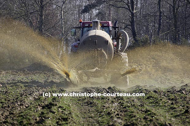 Livestock Waste Spreading in field. France