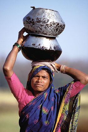 Indian Woman. Carrying water for cooking